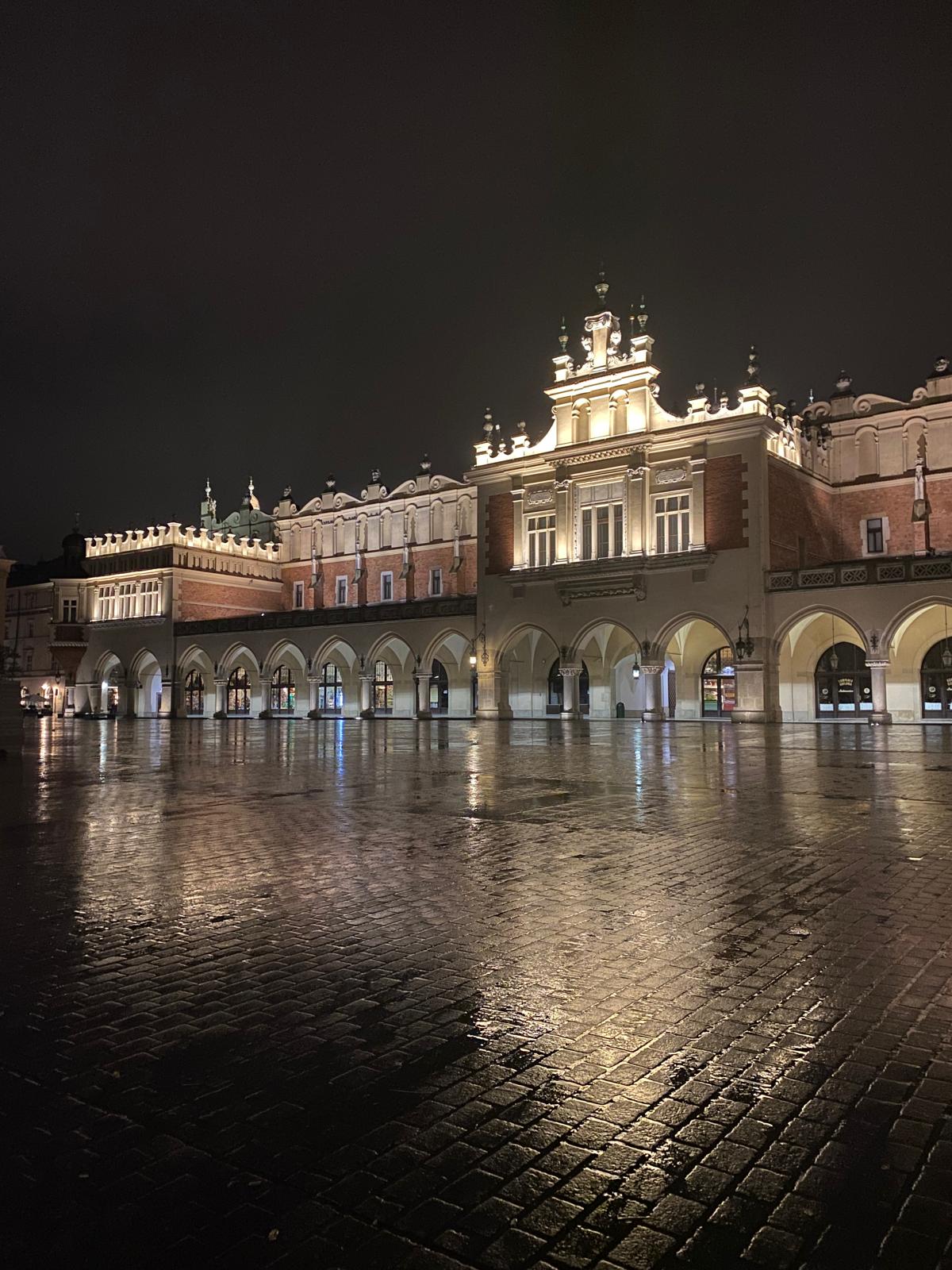 Illuminated Cloth Hall in Krakow after the rain
